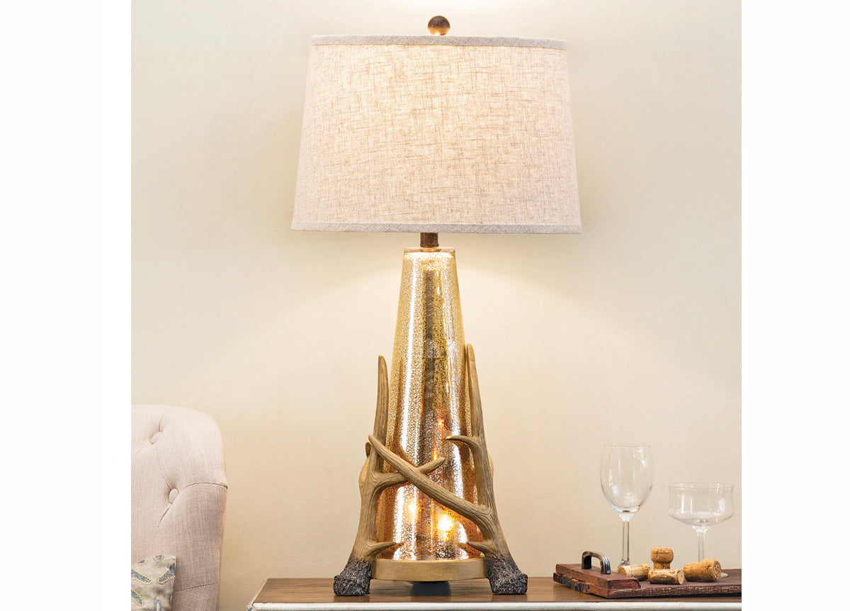 Antler Base Table Lamp with Glass on a Table