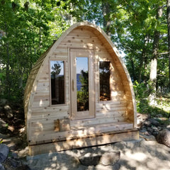 Knotty Pod with bevel siding, porch and windows