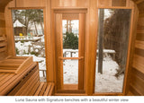 Luna Sauna with signature benches with a beautiful winter view