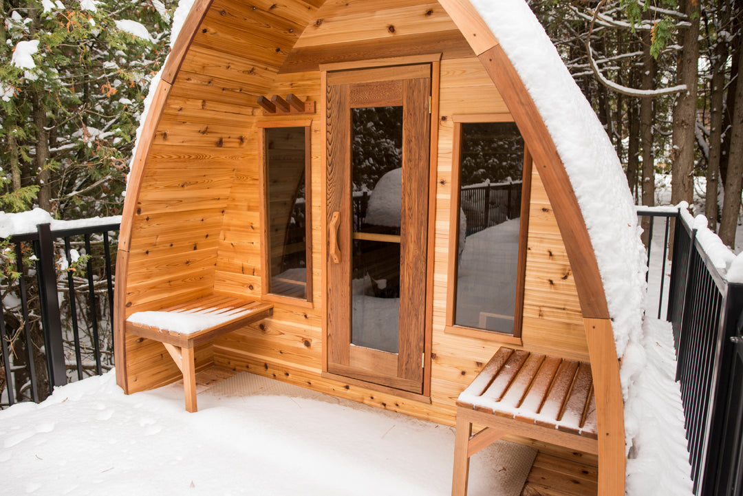 Exterior of Pod sauna with porch and 2 windows in the winter