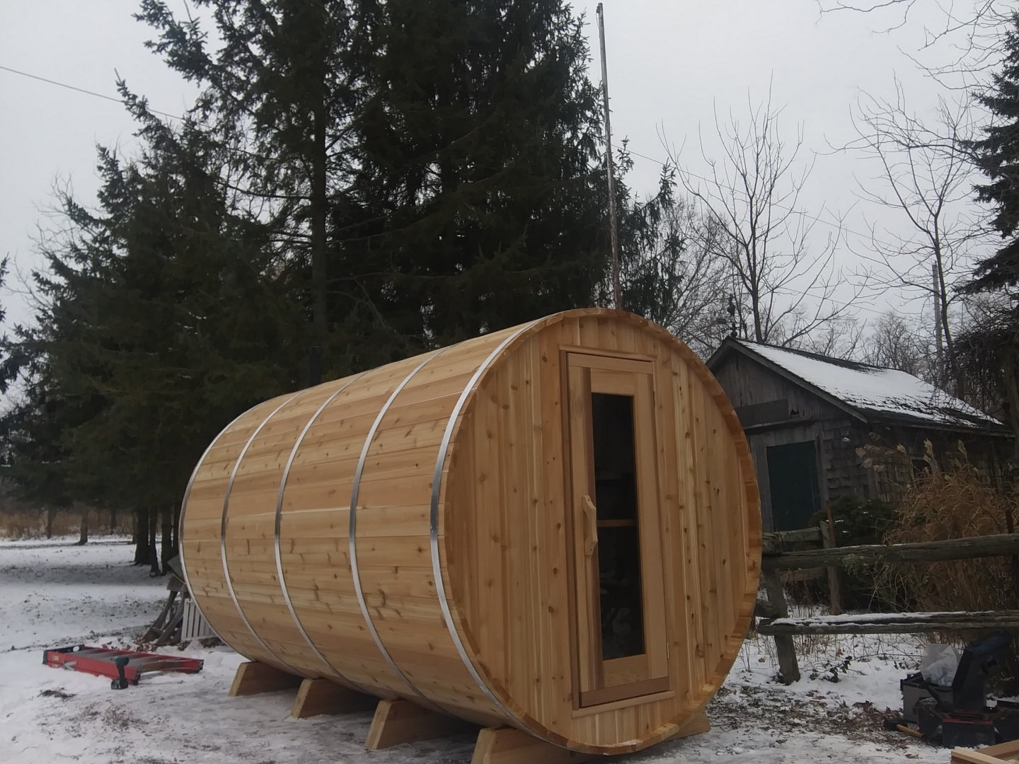 Large Knotty Barrel Sauna in winter