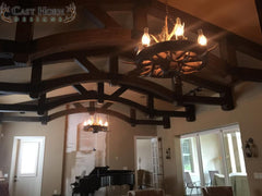Wagon wheel chandelier in cottage
